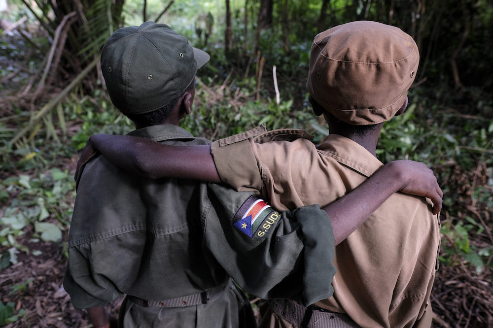 Arm in arm, these child soldiers are free to return home and go to